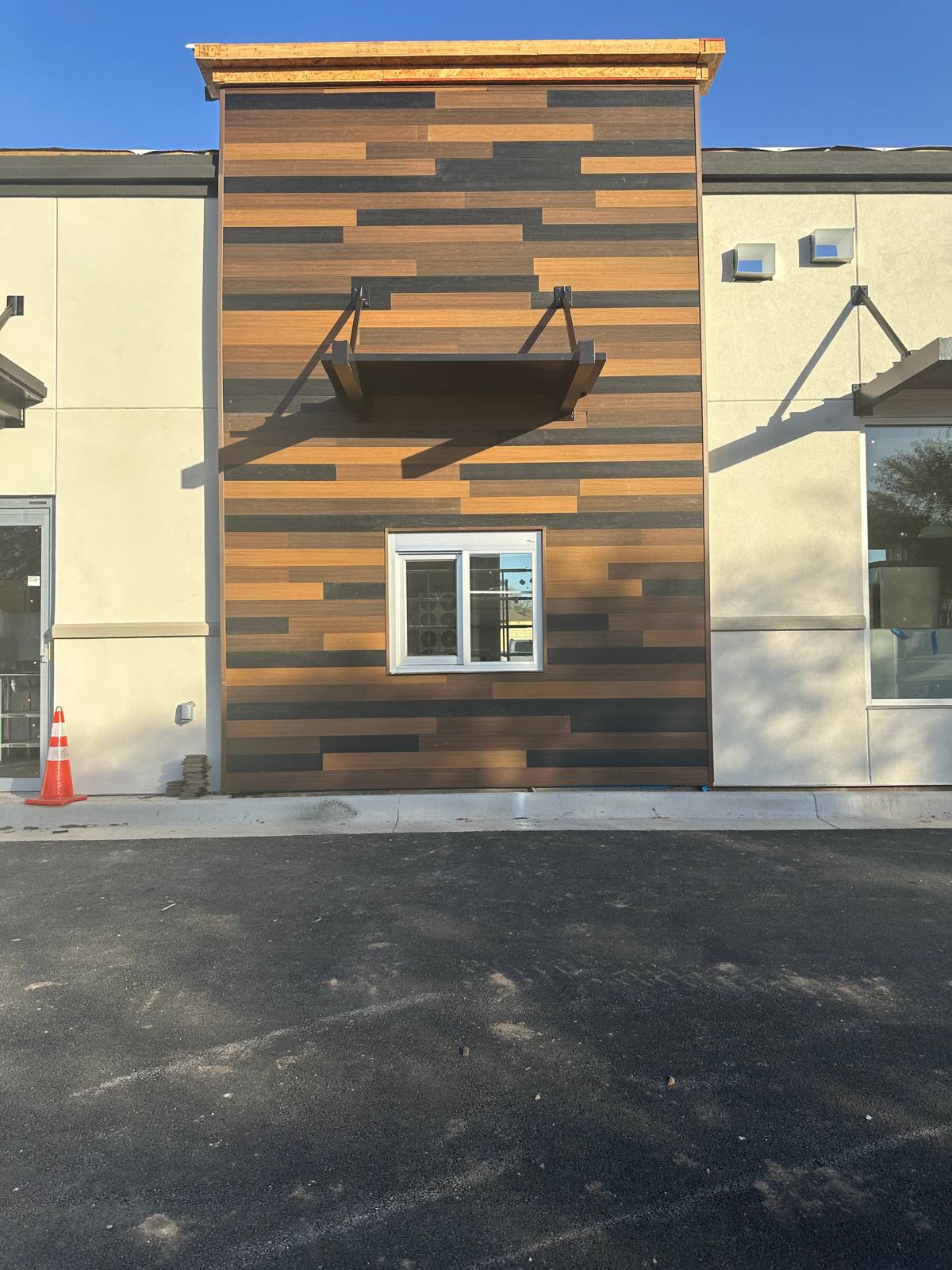 Composite wood-look siding on a storefront