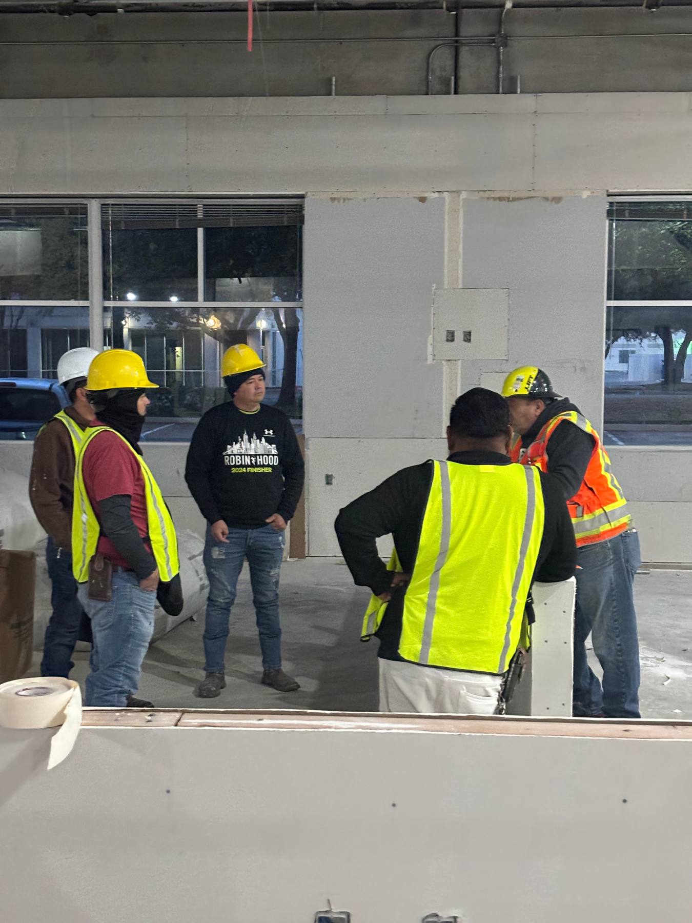 Foreman and crew reviewing work on site